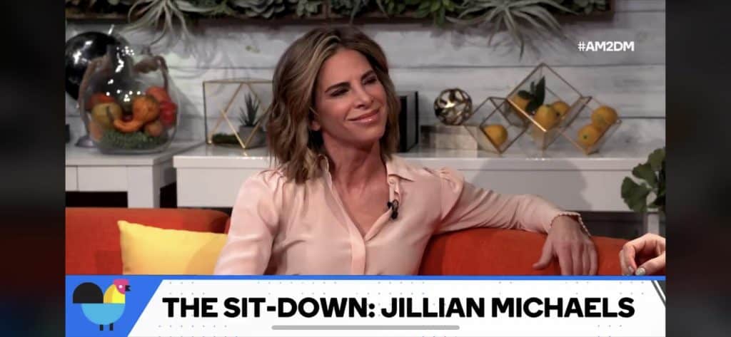 Photo of Jillian Michaels on Buzzfeed's AM2DM couch with smug grin on her face